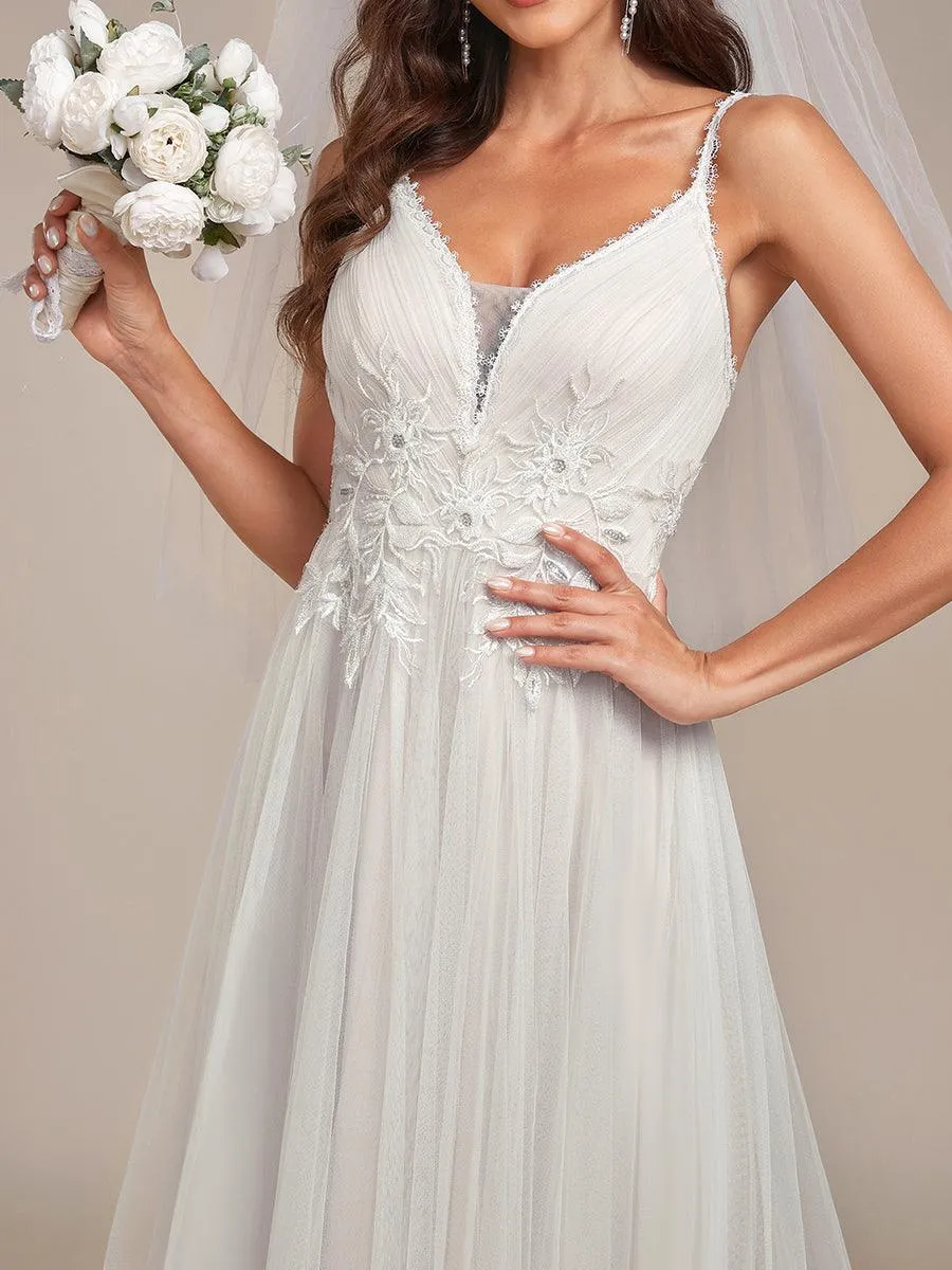 Robe de mariée A-ligne à encolure en V brodée à bretelles spaghetti