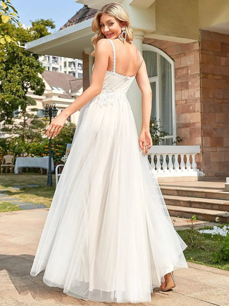 Robe de mariée A-ligne à encolure en V brodée à bretelles spaghetti