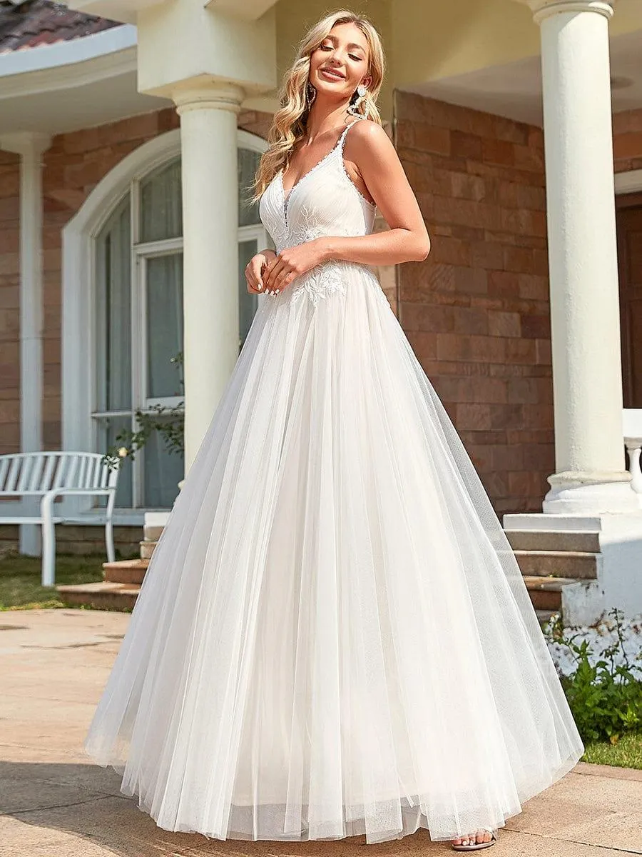 Robe de mariée A-ligne à encolure en V brodée à bretelles spaghetti