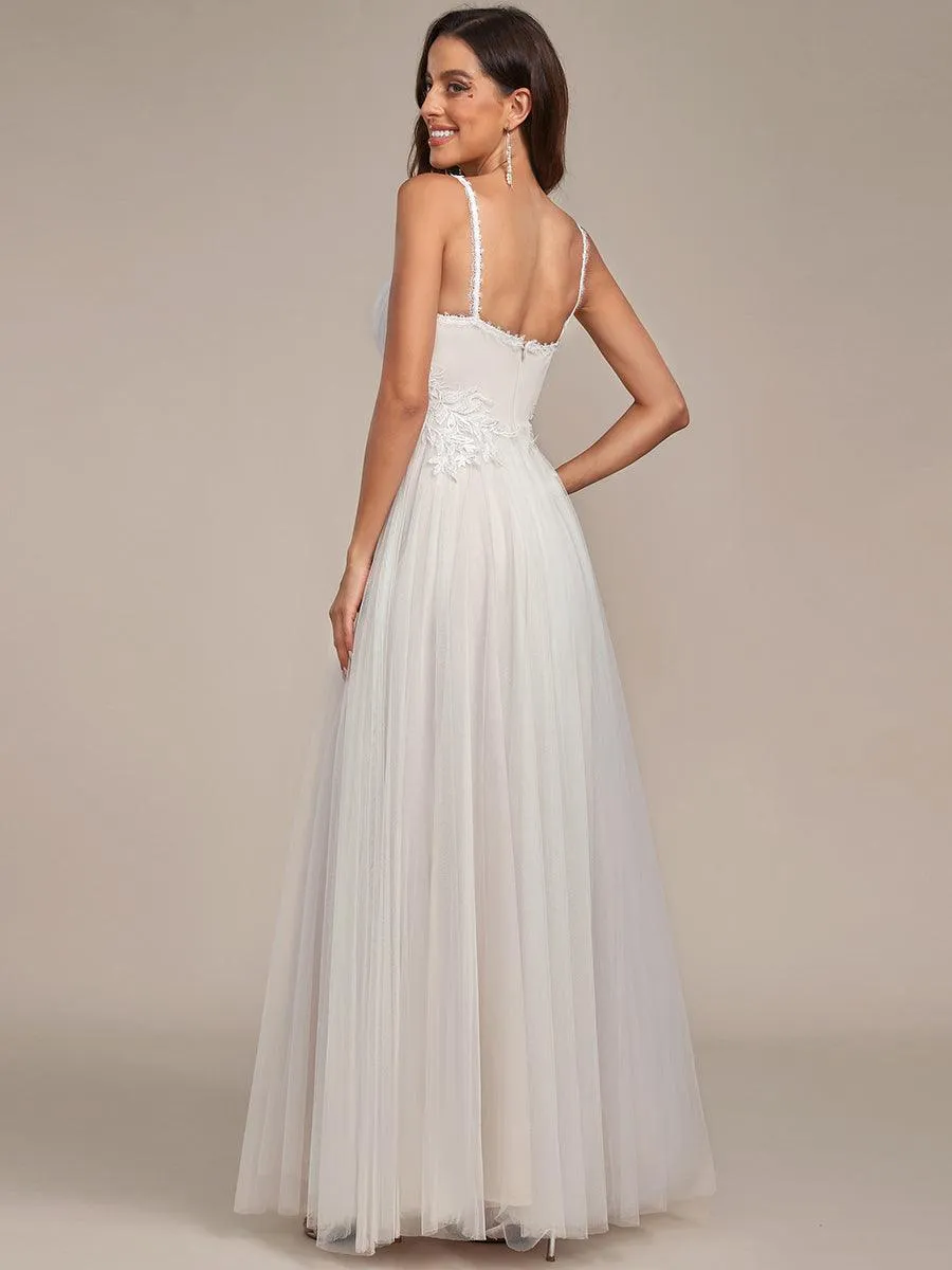 Robe de mariée A-ligne à encolure en V brodée à bretelles spaghetti