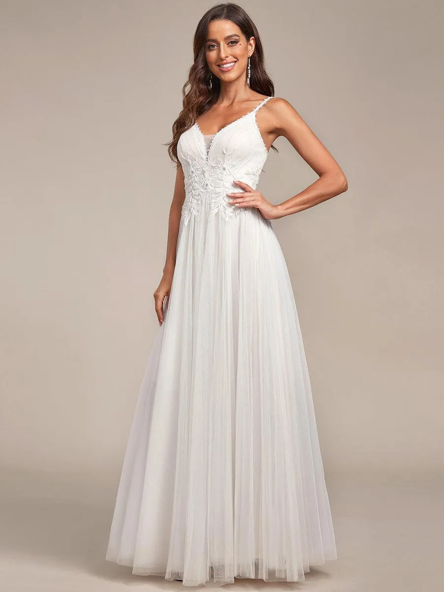 Robe de mariée A-ligne à encolure en V brodée à bretelles spaghetti